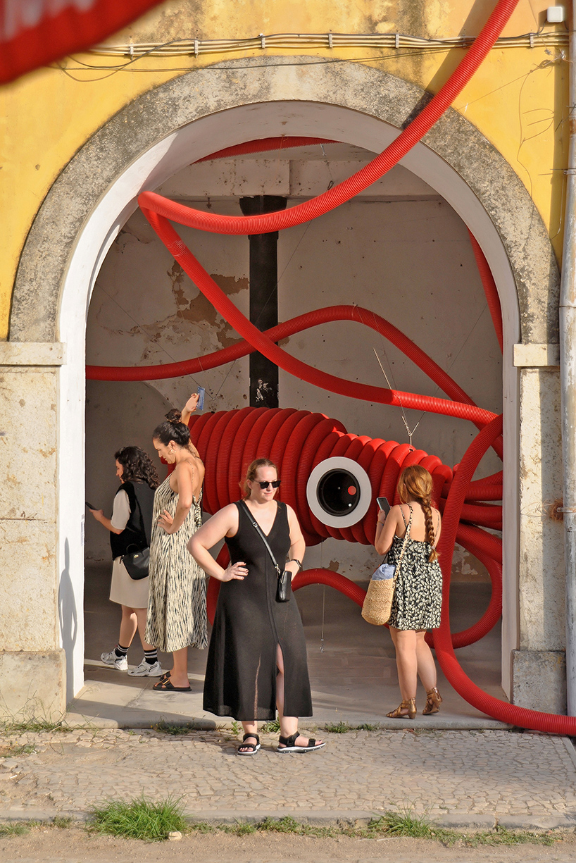 moradavaga's giant squid's tentacles embrace old beer factory in portugal