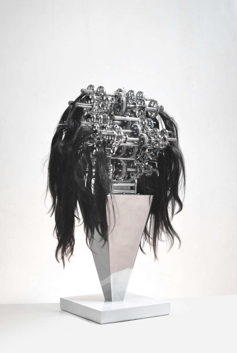 kinetic machine with hair caught in it explores the chaos and anxiety of  our reality
