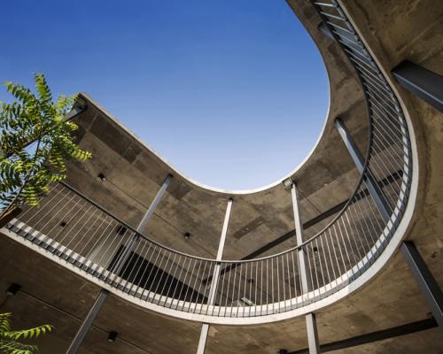 EJA wraps concrete + brick vermani house around circular courtyard