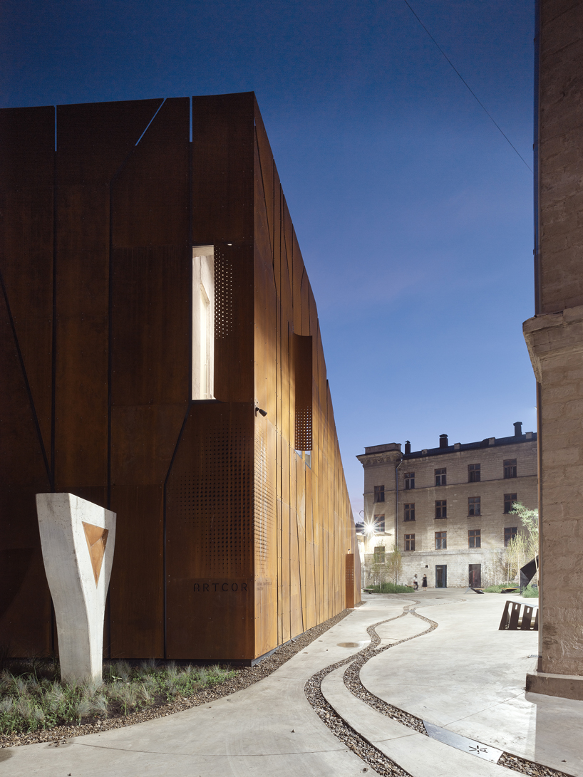 maxim calujac wraps corten steel and an external staircase around an art center in moldova designboom