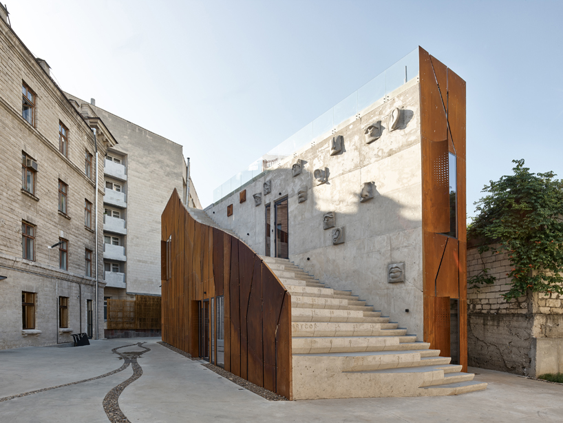 maxim calujac wraps corten steel and an external staircase around an art center in moldova designboom