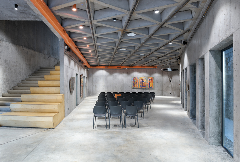 maxim calujac wraps corten steel and an external staircase around an art center in moldova designboom
