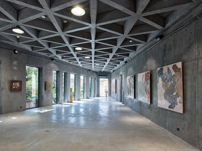 maxim calujac wraps corten steel and an external staircase around an art center in moldova designboom
