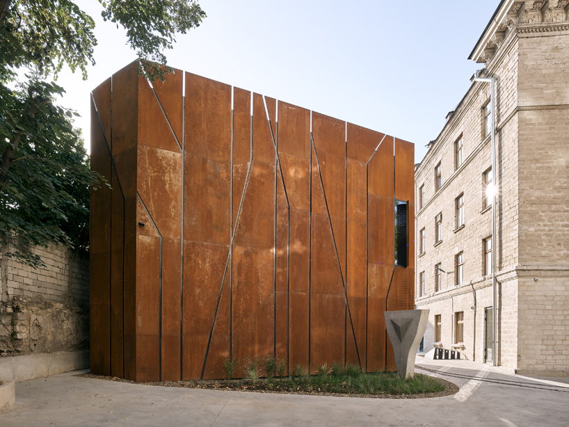 maxim calujac wraps corten steel and an external staircase around an art center in moldova designboom