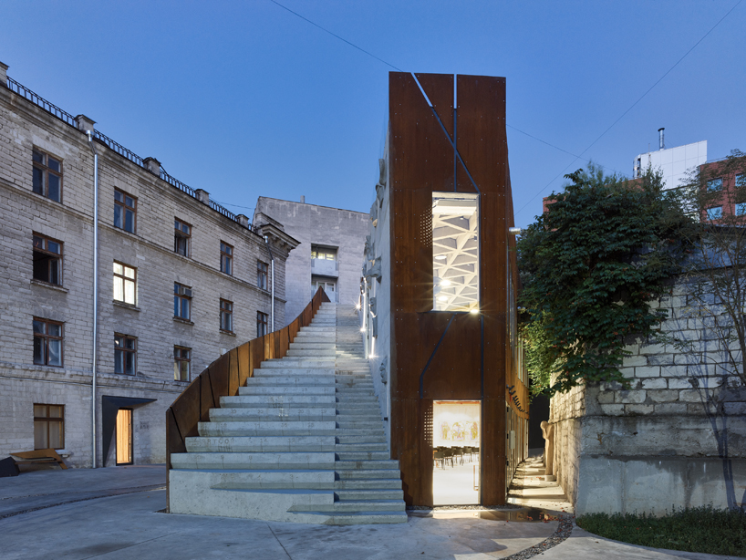 maxim calujac wraps corten steel and an external staircase around an art center in moldova designboom