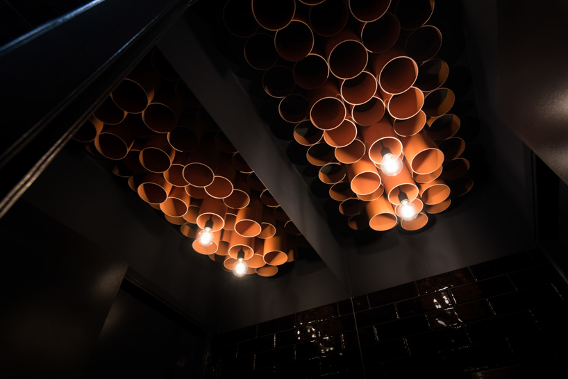mode:lina uses 300 PVC pipes to decorate burger spot in poznań designboom