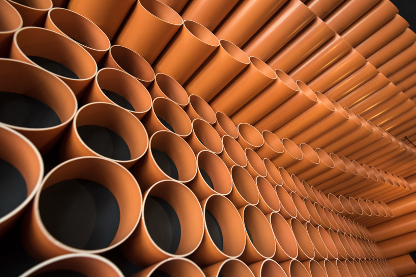 mode:lina uses 300 PVC pipes to decorate burger spot in poznań designboom