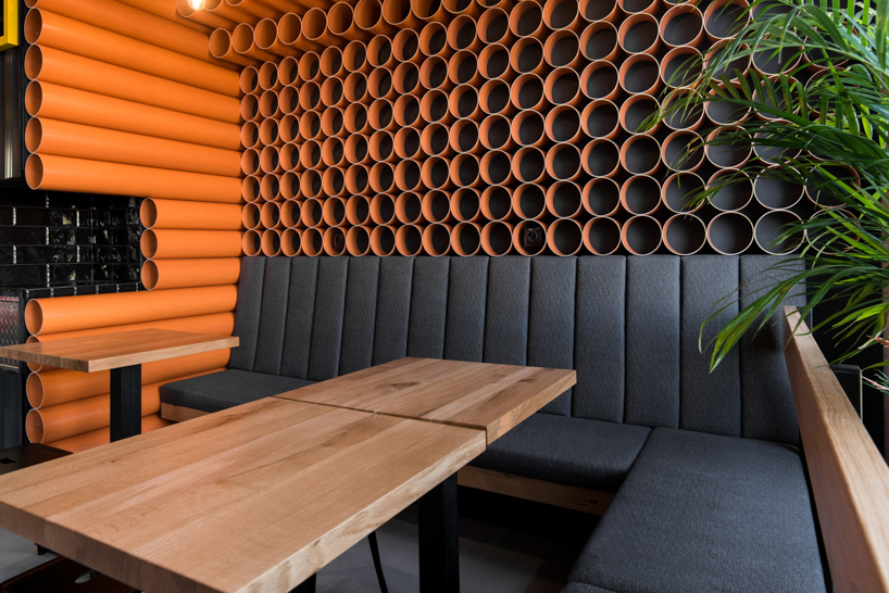 mode:lina uses 300 PVC pipes to decorate burger spot in poznań designboom