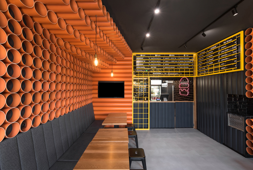 mode:lina uses 300 PVC pipes to decorate burger spot in poznań designboom