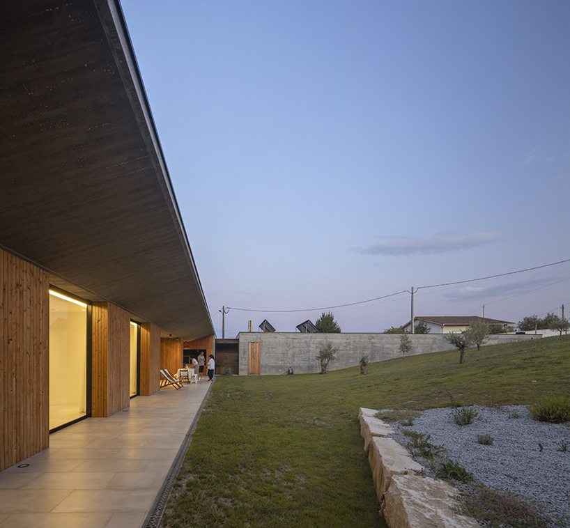 contaminar designs an l shape concrete house surrounded by olive trees in porto de mos 10