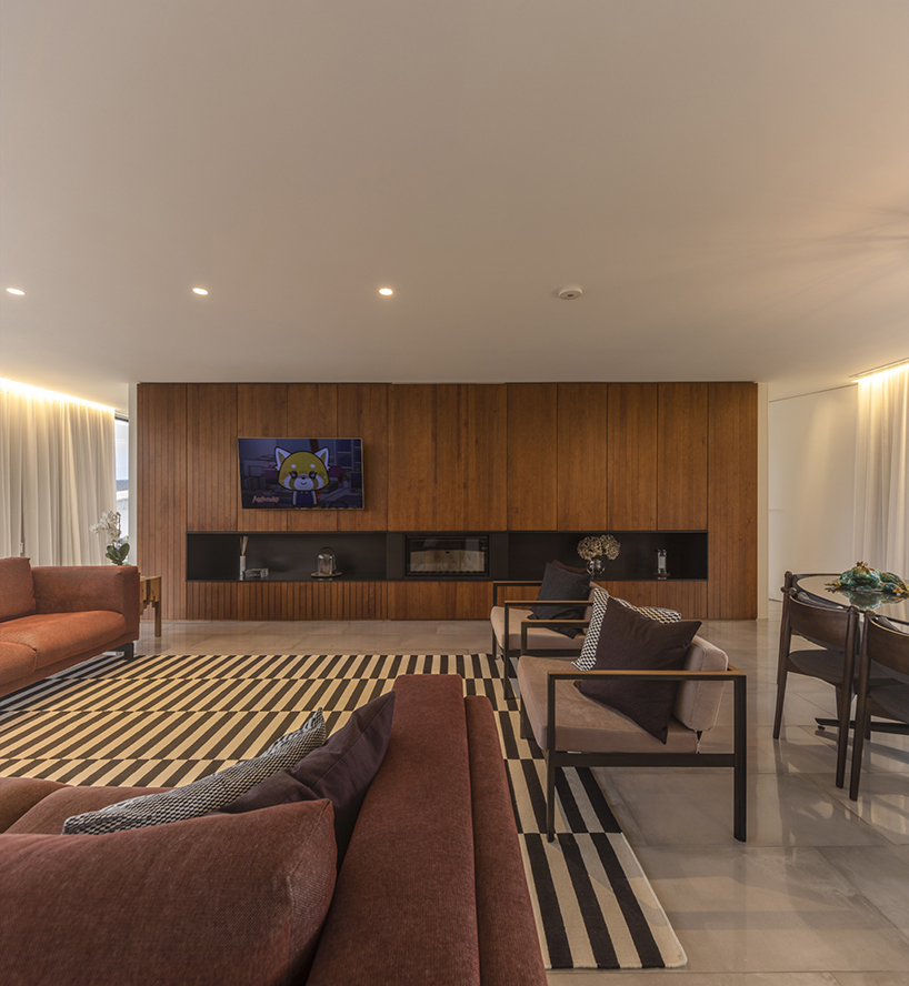 contaminar designs an l shape concrete house surrounded by olive trees in porto de mos 11