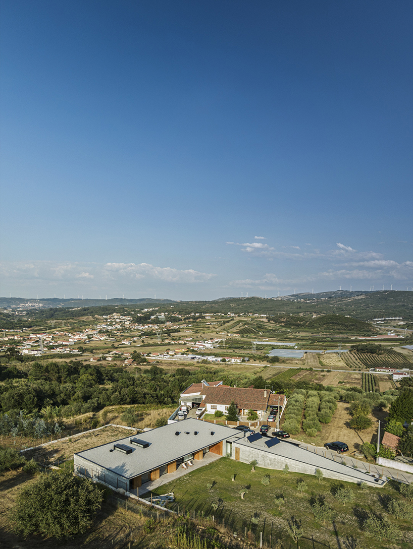 contaminar designs an l shape concrete house surrounded by olive trees in porto de mos 2