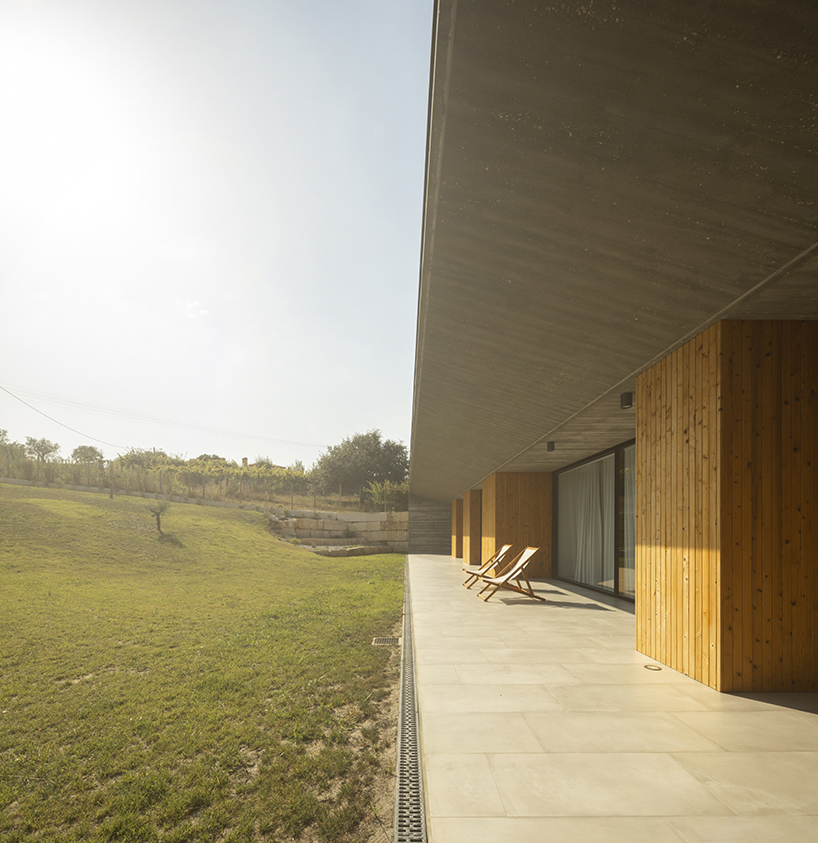 contaminar designs an l shape concrete house surrounded by olive trees in porto de mos 4