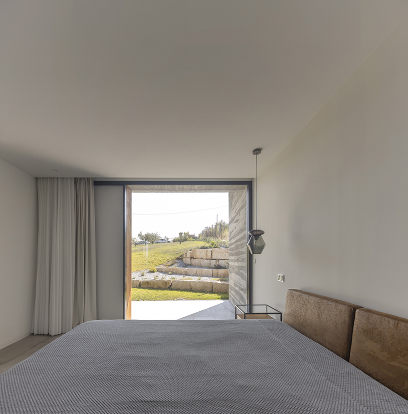 contaminar designs an l shape concrete house surrounded by olive trees in porto de mos 7