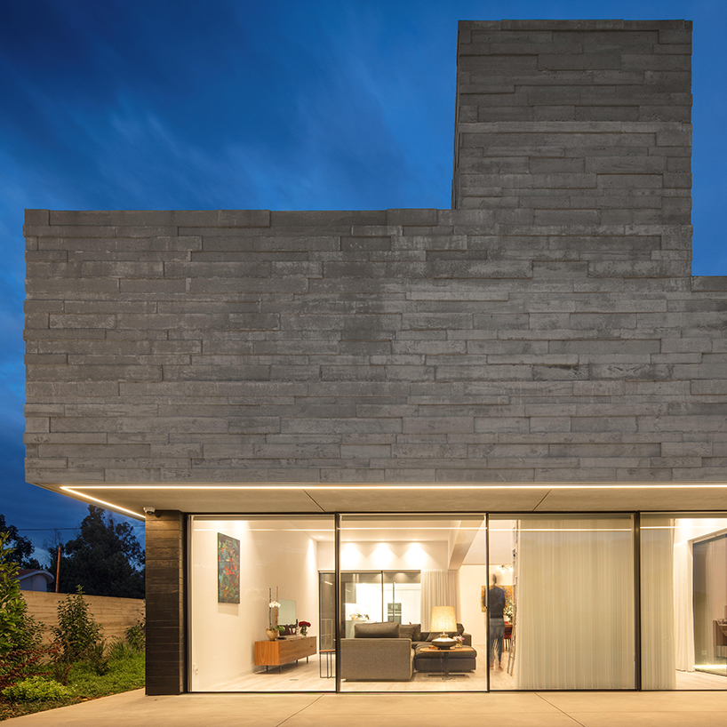 spaceworkers designs a 'house for books' with a monolithic roof in rural portugal designboom
