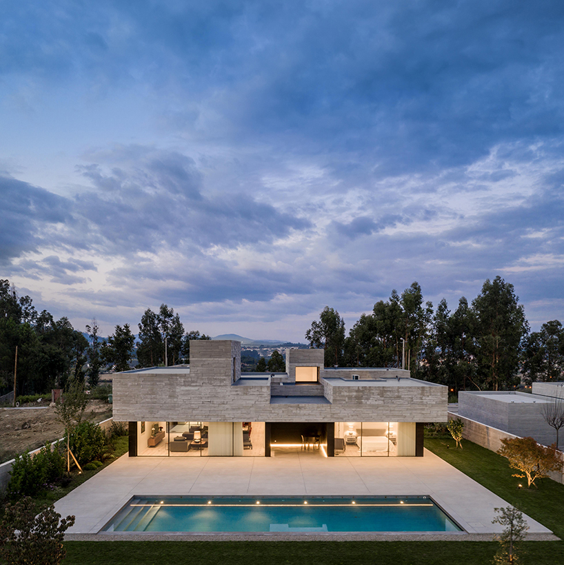 spaceworkers designs a 'house for books' with a monolithic roof in rural portugal designboom