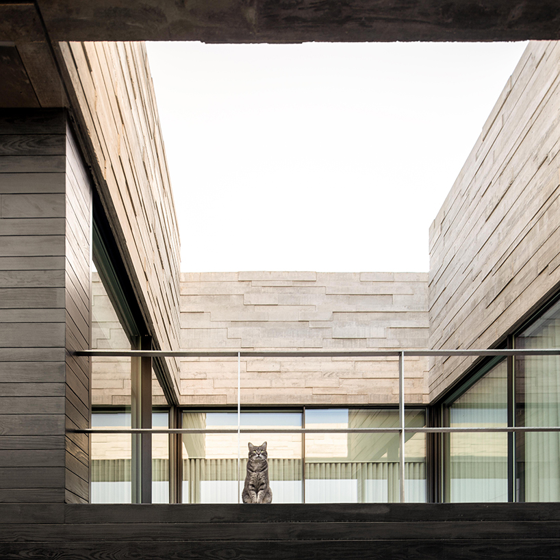 spaceworkers designs a 'house for books' with a monolithic roof in rural portugal designboom