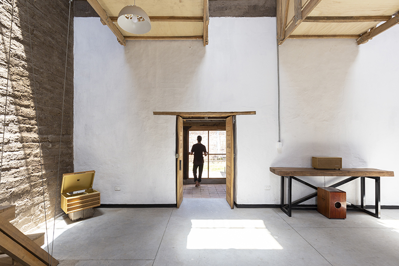 al borde refurbishes an 18th century ruin in ecuador into family house with suspended beds designboom