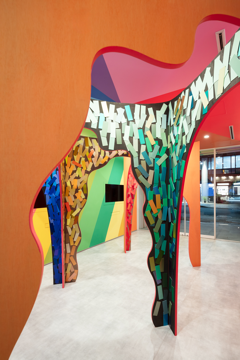 moriyuki ochiai architects crafts chromatic maze from discarded paint samples for showroom in tokyo