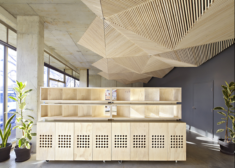 assemble studio features geometric origami ceiling