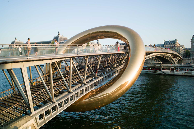 plastique fantastique's ringed installation envelops parisian footbridge for nuit blanche 2023