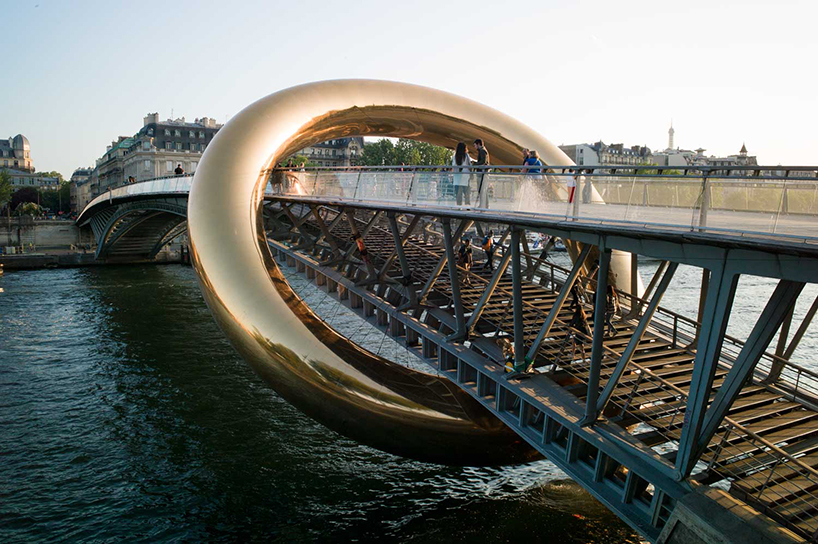 plastique fantastique's ringed installation envelops parisian footbridge for nuit blanche 2023