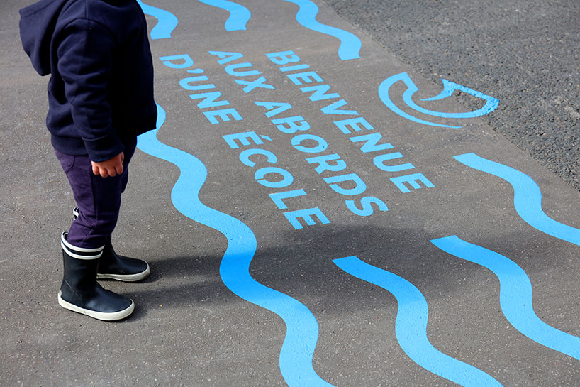 wave-themed street signage system by studio 5•5 encourages parisians to social distance