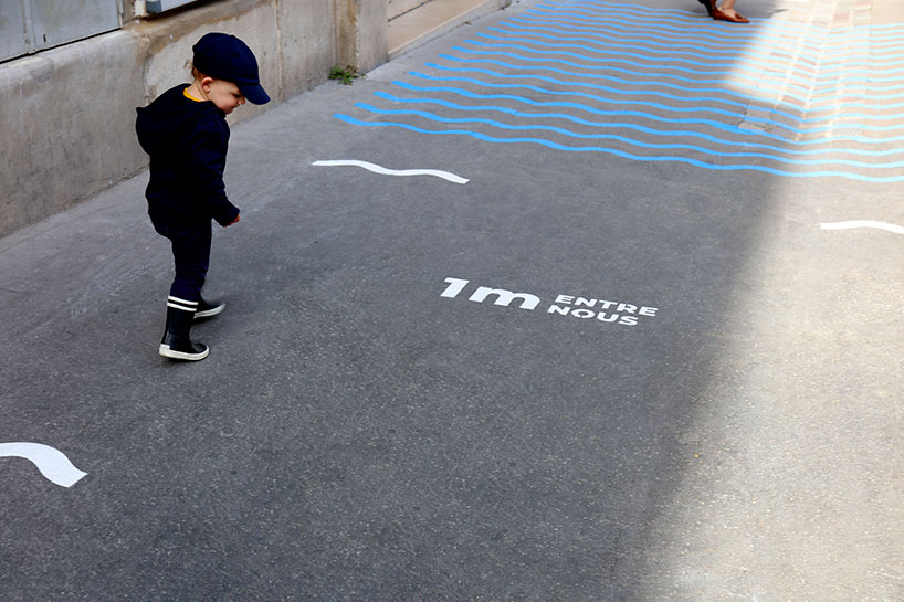 wave-themed street signage system by studio 5•5 encourages parisians to social distance