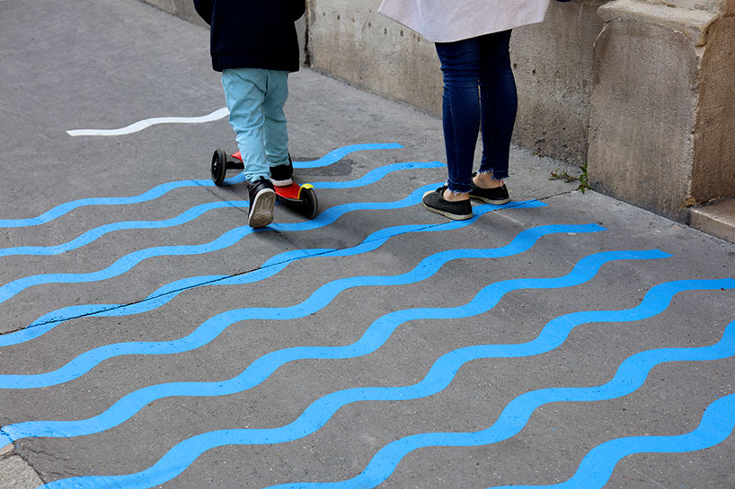 wave-themed street signage system by studio 5•5 encourages parisians to social distance