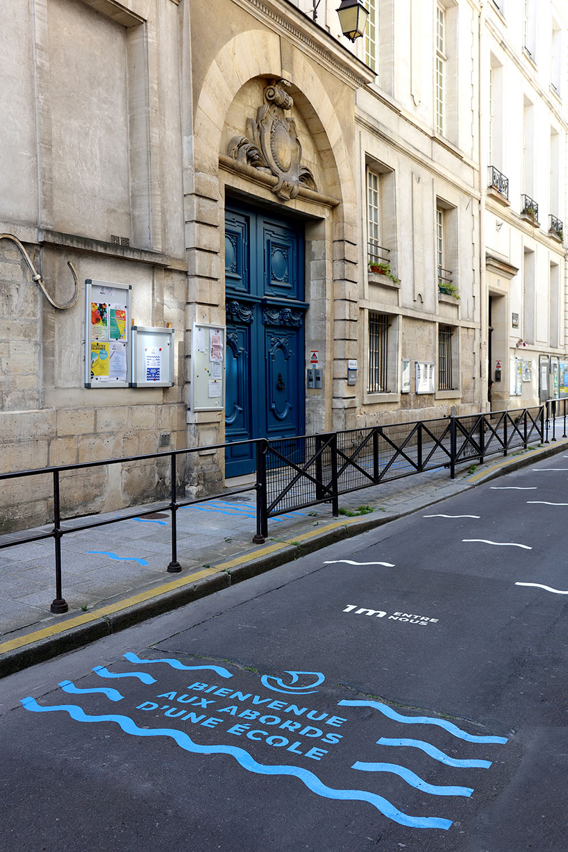 wave-themed street signage system by studio 5•5 encourages parisians to social distance