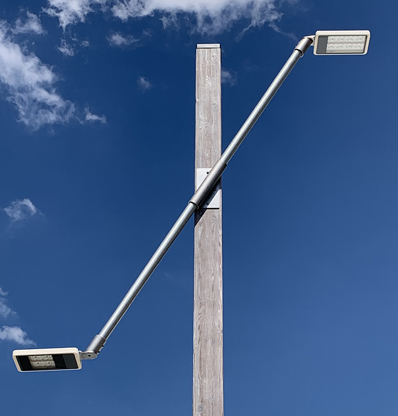 studio 5•5 repurposes old scaffolding pipes and street lamps to illuminate paris olympic village