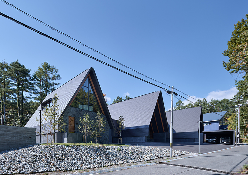 triangular volumes of GENETO's resort in japan echoes the mountain peaks beyond