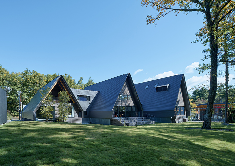 triangular volumes of GENETO's resort in japan echoes the mountain peaks beyond