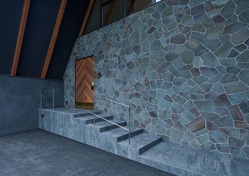 triangular volumes of GENETO's resort in japan echoes the mountain peaks beyond