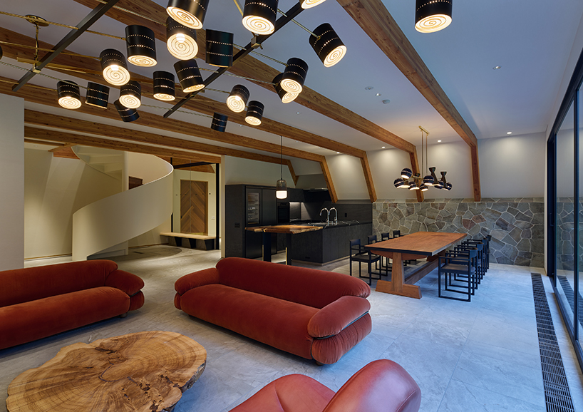 triangular volumes of GENETO's resort in japan echoes the mountain peaks beyond