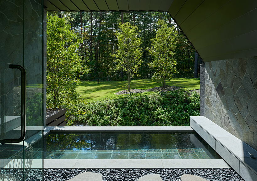 triangular volumes of GENETO's resort in japan echoes the mountain peaks beyond