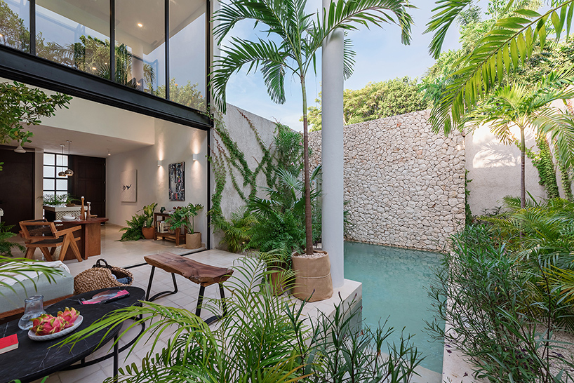 stone lattice facade clads tropical vacation house by workshop in mexico