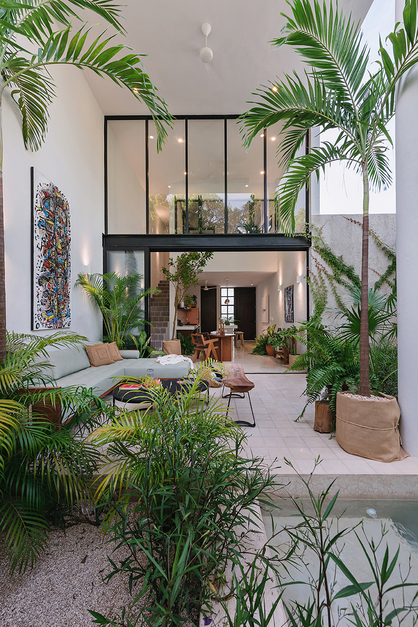 stone lattice facade clads tropical vacation house by workshop in mexico