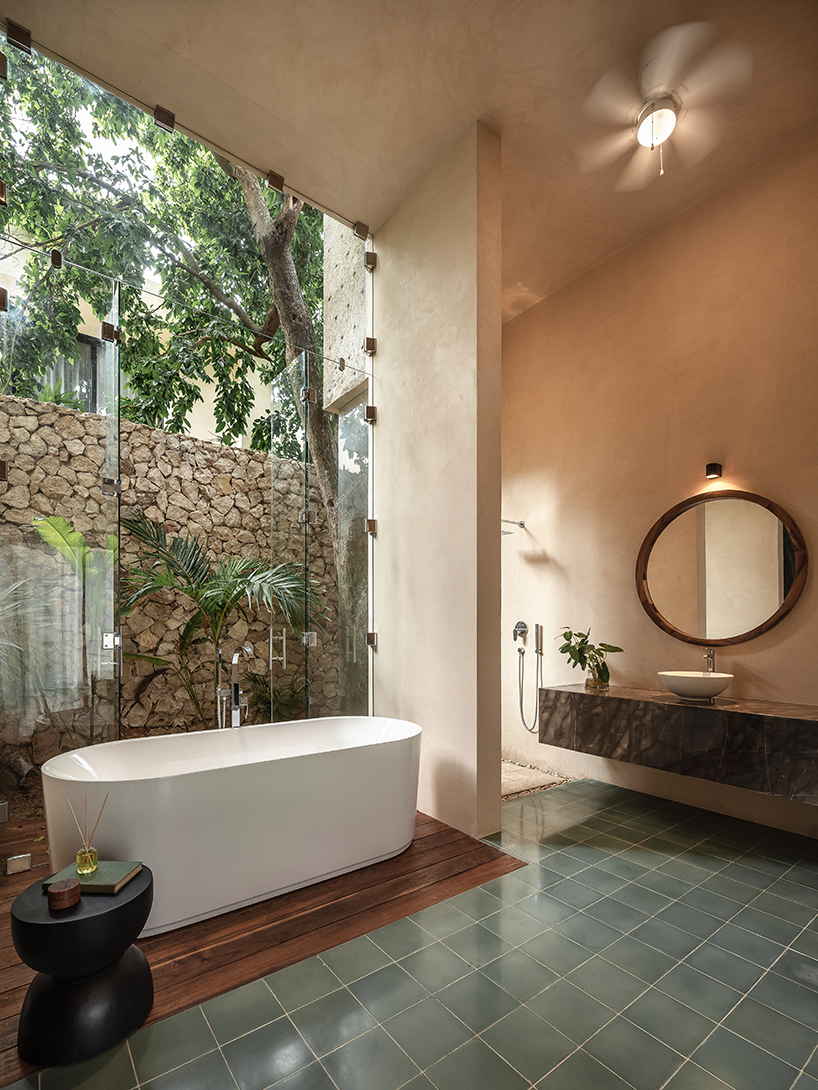 workshop architects preserves 20th-century stone masonry for contemporary mexican home