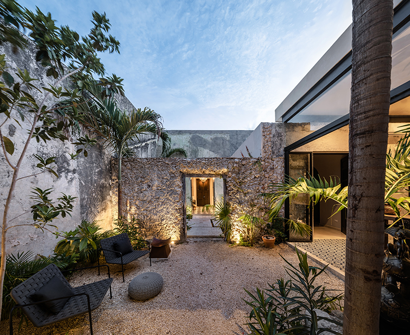 workshop architects preserves 20th-century stone masonry for contemporary mexican home