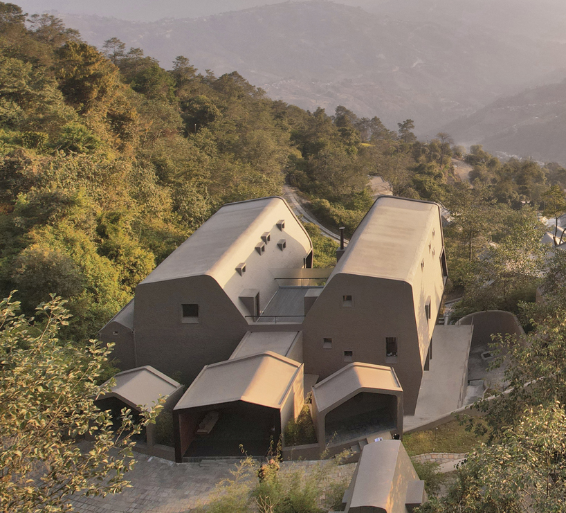 MAP's cloud catcher emerges from nepal hillside resort as two rock-like volumes