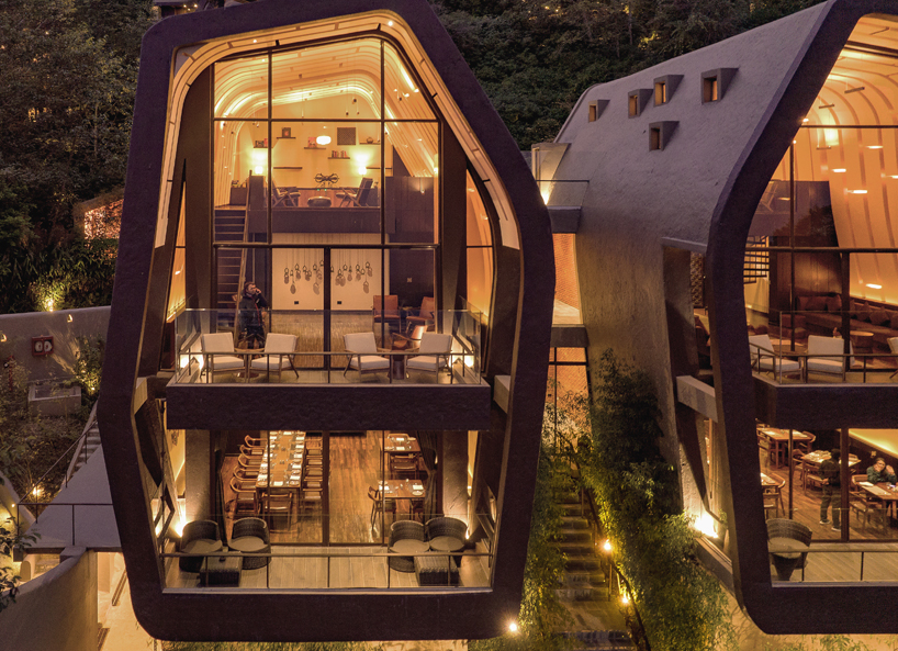 map sculpts the cloud catcher of a hillside resort in two rock like volumes 12