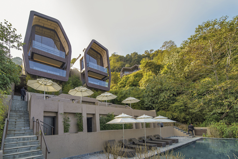 MAP's cloud catcher emerges from nepal hillside resort as two rock-like volumes