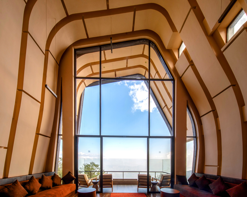 MAP's cloud catcher emerges from nepal hillside resort as two rock-like volumes