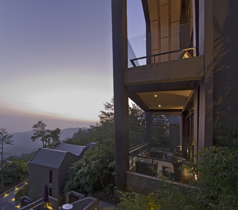 map sculpts the cloud catcher of a hillside resort in two rock like volumes 8