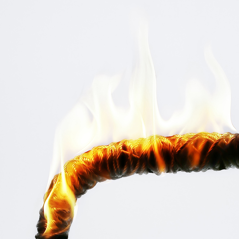takt project sets fibreglass-shell chair in flames to uncover the underlying value of design