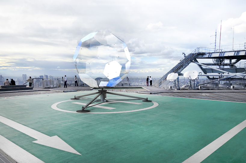 vincent leroy's geodesic 'illusion lens' installation lands on a tokyo rooftop designboom