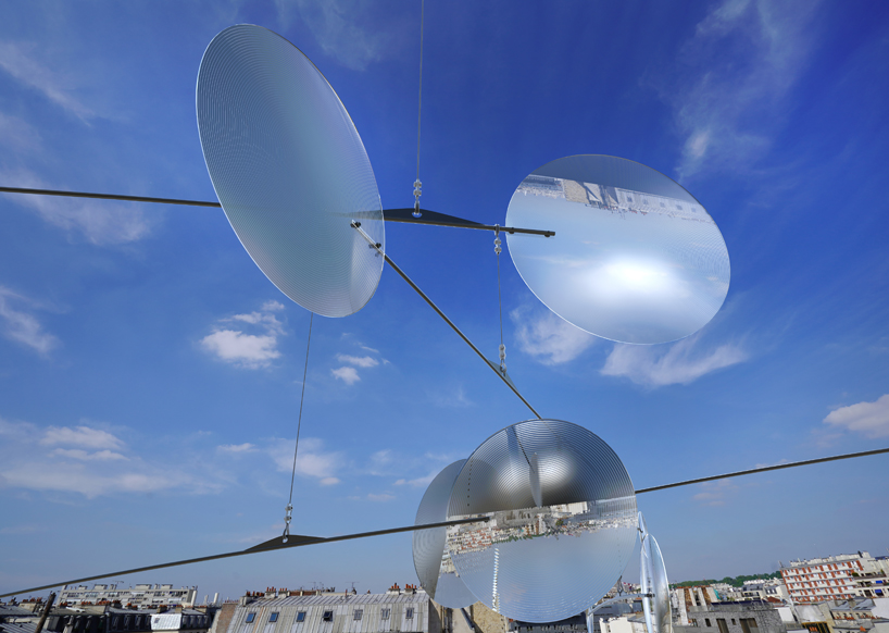vincent leroy filters reality with 'floating lens' installation on parisian rooftops