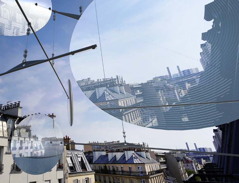 vincent leroy filters reality with 'floating lens' installation on parisian rooftops
