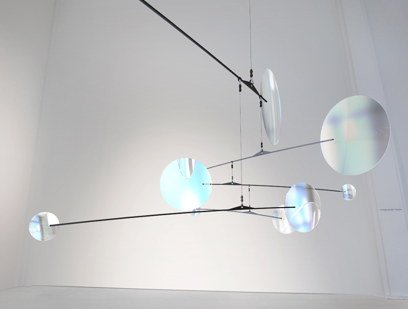 vincent leroy filters reality with 'floating lens' installation on parisian rooftops